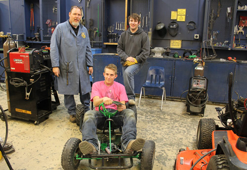 Students and teacher with go kart