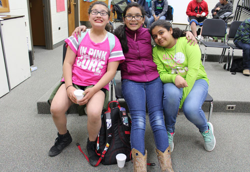 Three smiling students