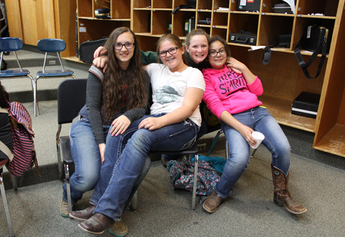 Four smiling students